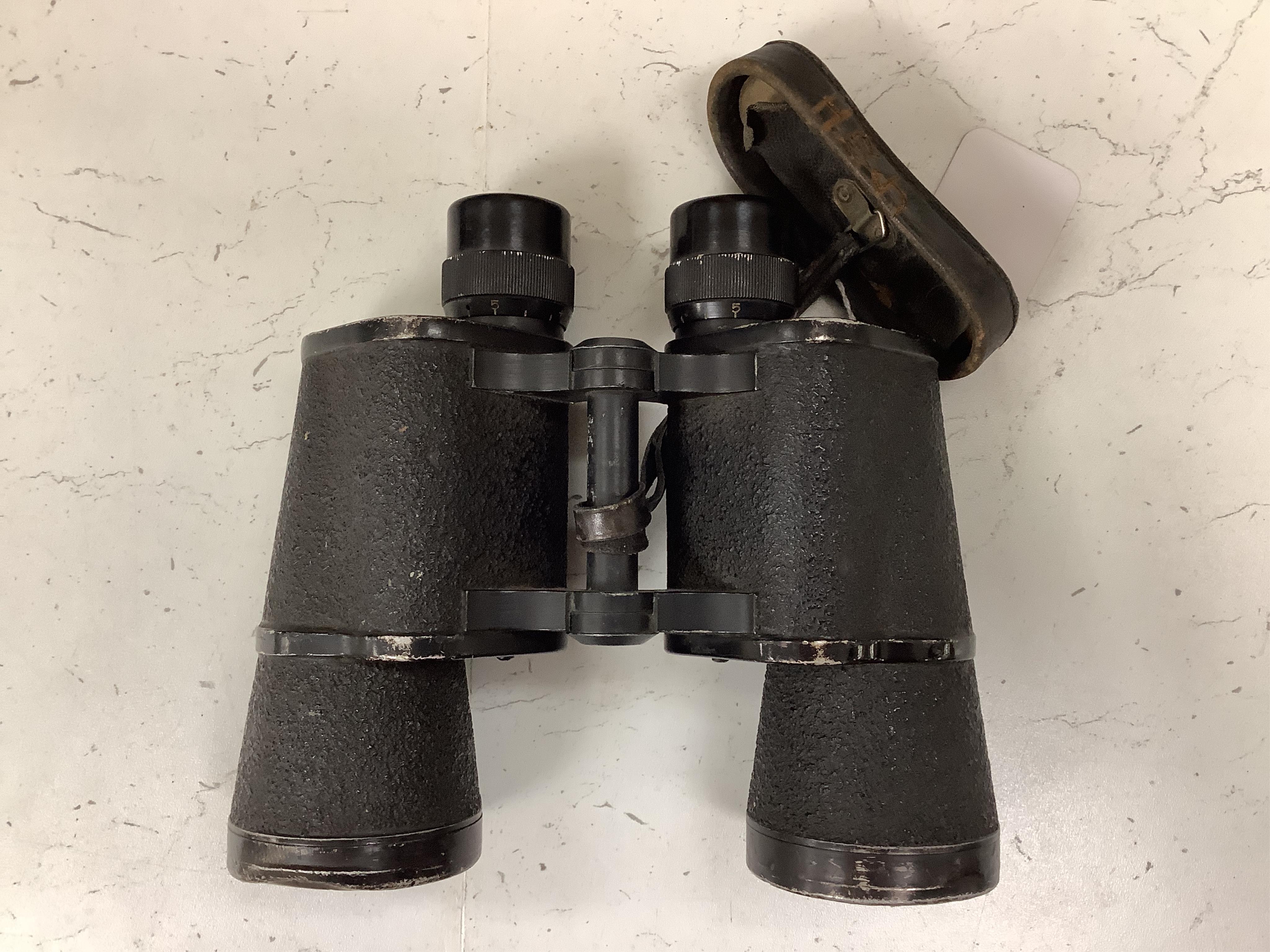 A pair of World War II German military binoculars, 17.5cm long. Condition - worn